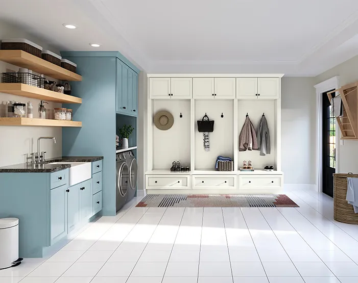 mudroom with blue and white cabinetry